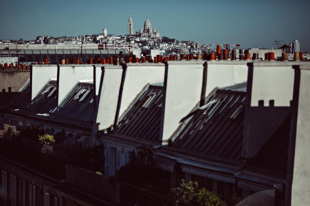 Monsieur George Hotel & Spa - Champs-Elysees Paris Exterior foto View of the roofs of Paris